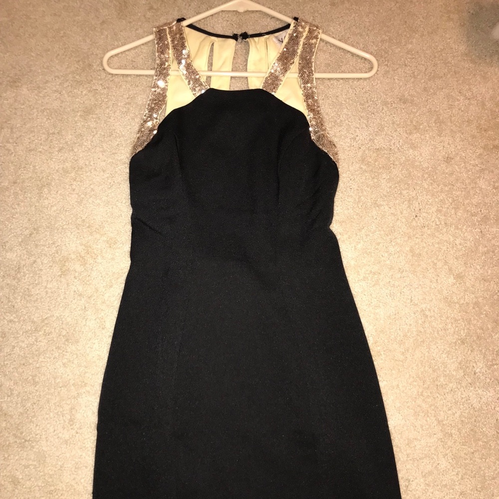 Short black dress with gold sequins